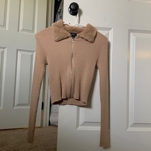M tan cropped, tight, zip-up jacket, with a furry collar from rue21.